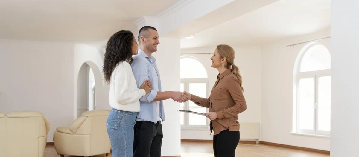 Selling a house privately with prepared paperwork, keys and property sale signing