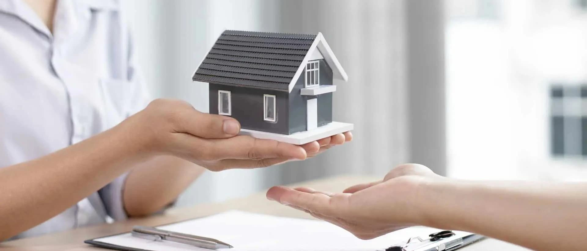 Private home sale contract with house keys, signing document and legal review
